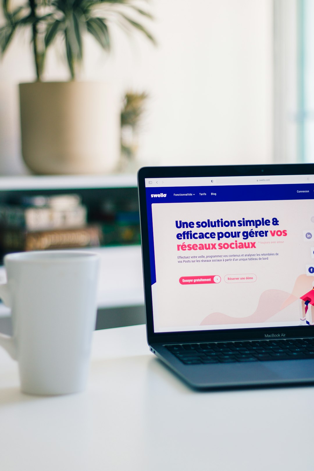 a-laptop-computer-sitting-on-top-of-a-white-table-14pl8lytpuo