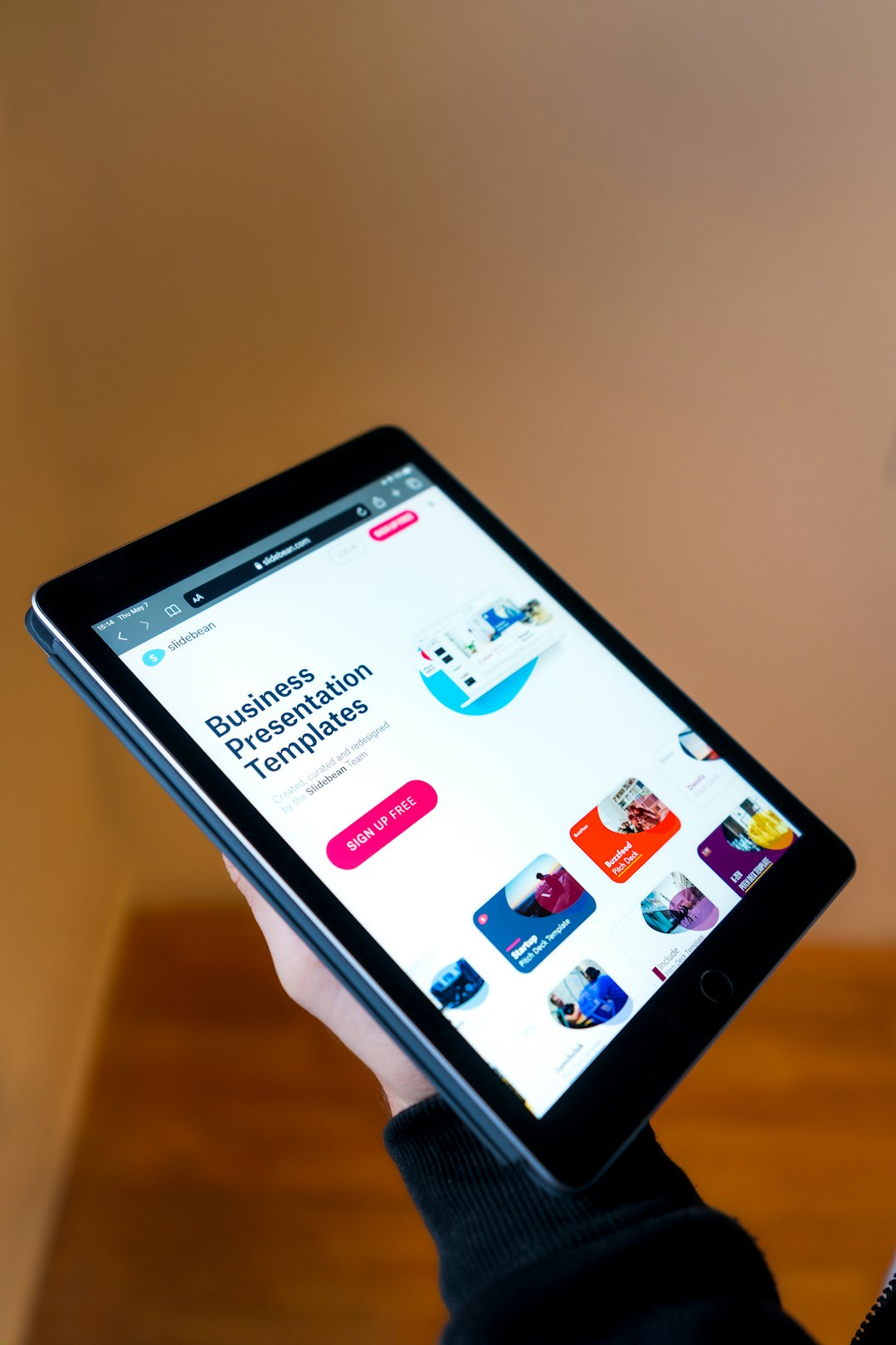 A person holding an iPad