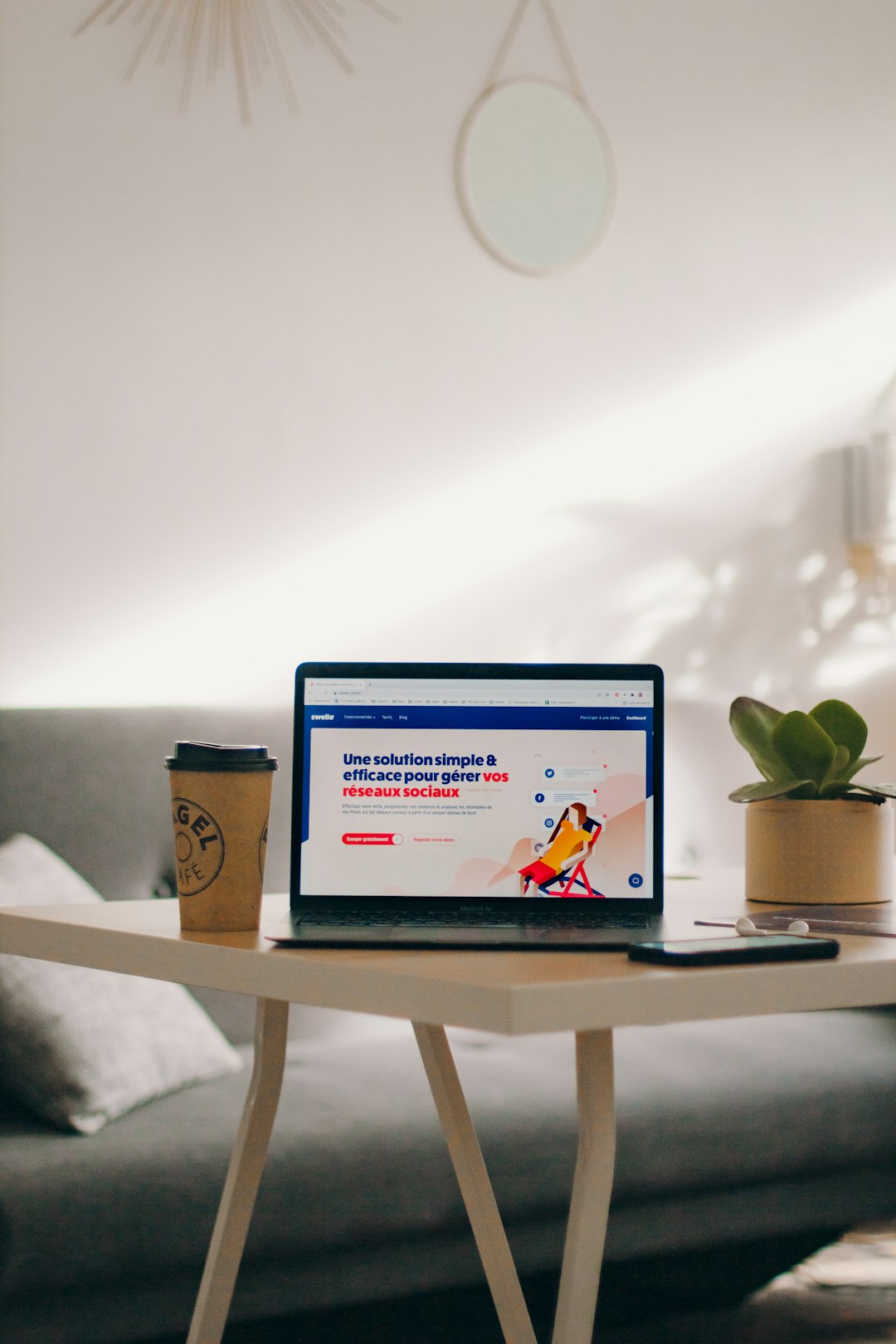a-laptop-computer-sitting-on-top-of-a-wooden-table-6jiii0bw2ey