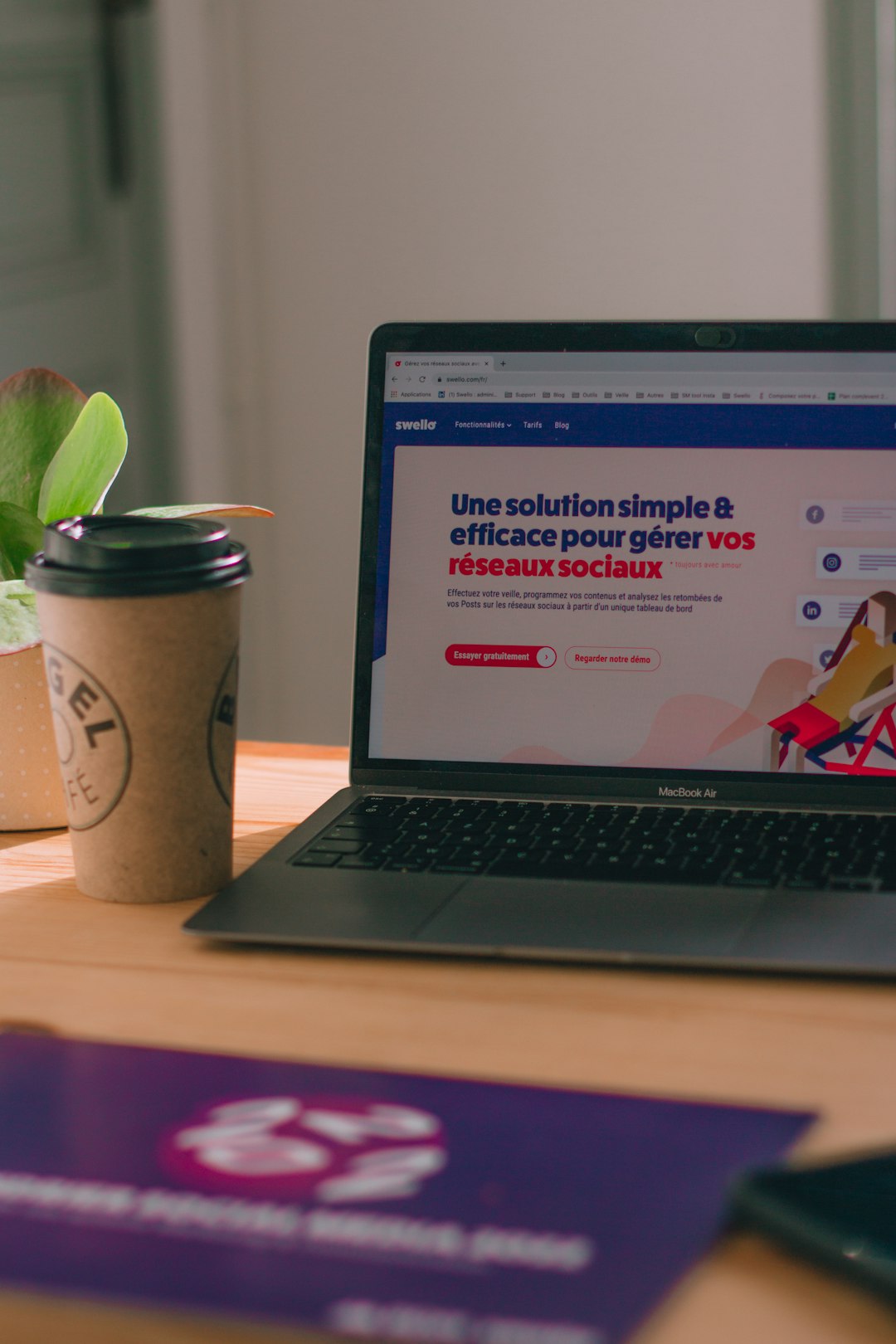 a-laptop-computer-sitting-on-top-of-a-wooden-table-tdqbtss8eye